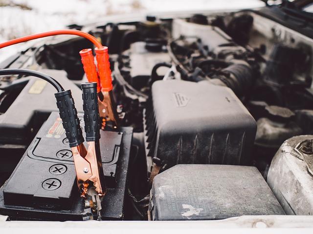 The positive and negative cables of a car battery.